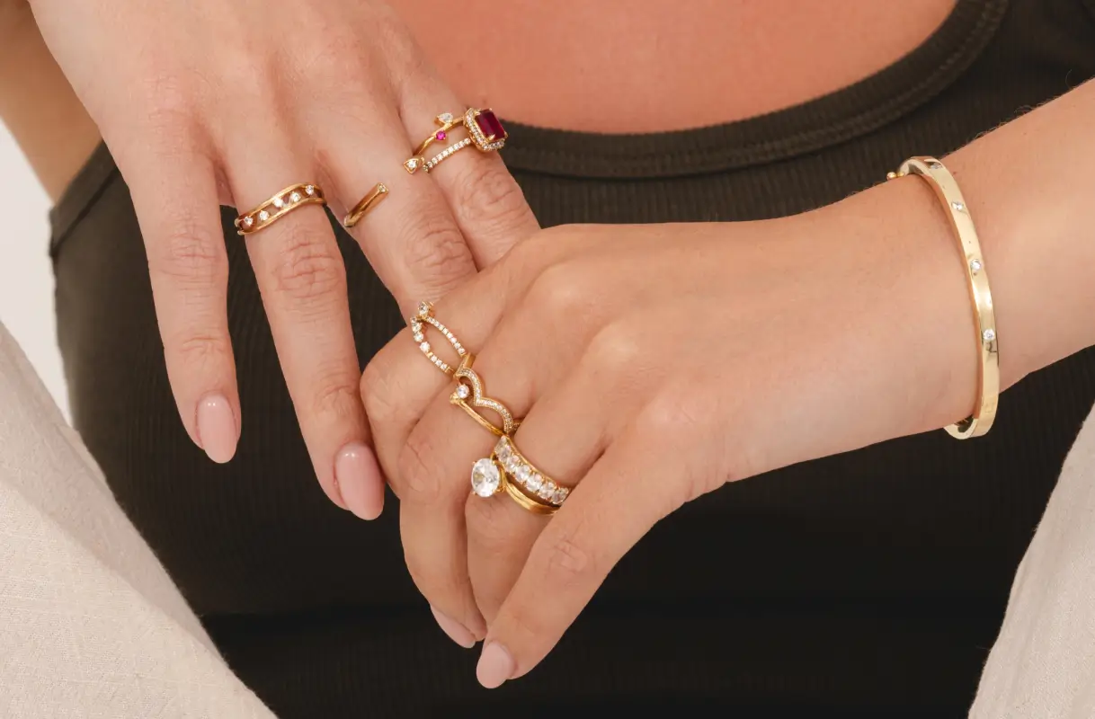 Woman wearing a variety of lab grown diamond rings from Austen & Blake lab diamond jewelry collection