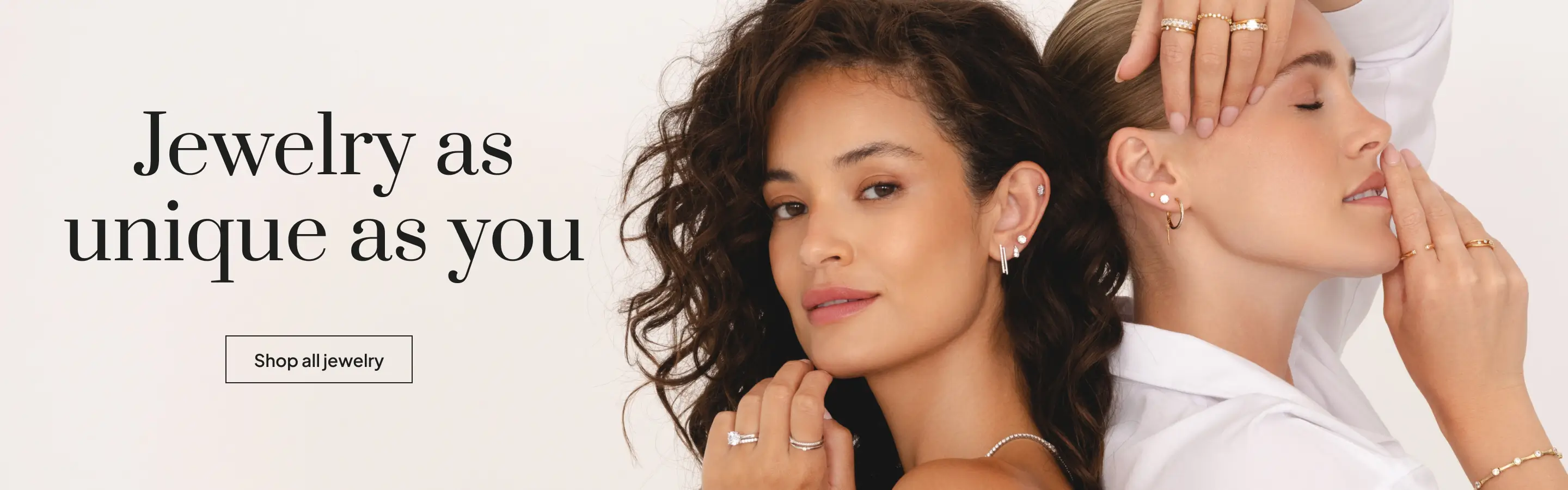 Two women wearing diamond rings, earrings & bracelets from Austen & Blake unique jewelry collections